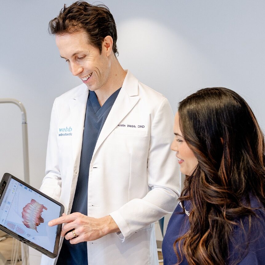 Dr. Austin Webb reviewing digital imaging with a patient during an orthodontic consultation at Webb Orthodontics.